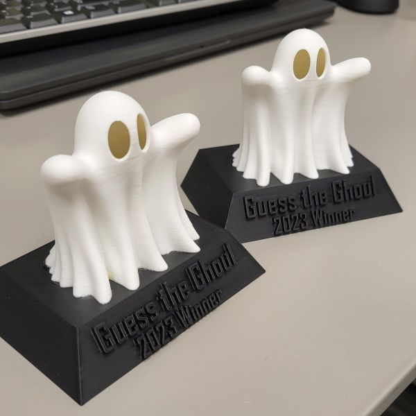White hollow ghost printed in white filament and glued to a base printed in black filament.