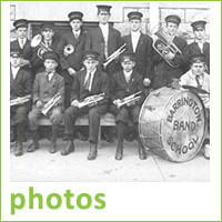 Black and white photo of old Barrington School Band, band members wearing uniforms, bass drum, text reads photos